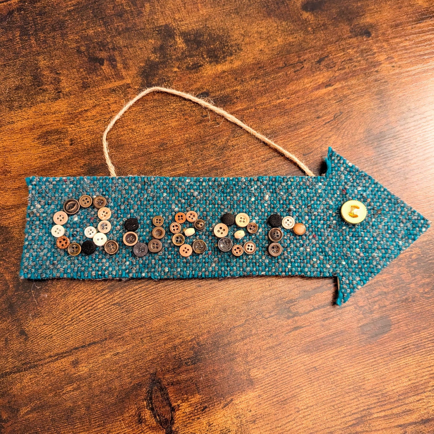 Queer Here Arrow Wall Hanging
