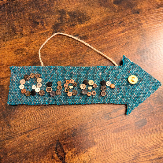 Queer Here Arrow Wall Hanging